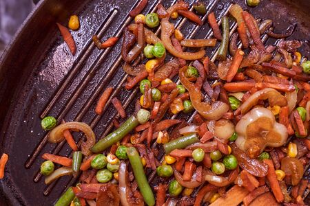 shaverma in homemade lacais rests on a grilled wooden spoon Closeup effectの写真素材