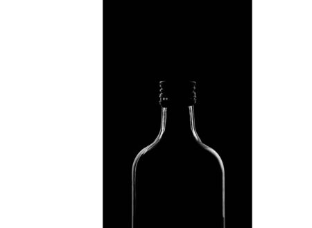 half a bottle on a black background. Only the silhouette is visible. High quality photoの写真素材