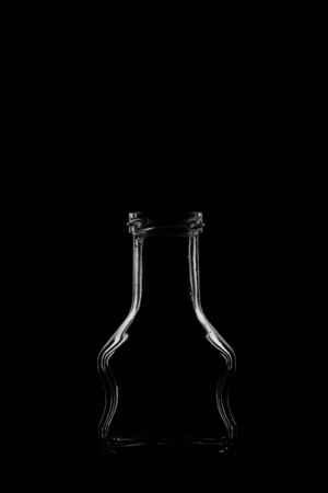 Silhouette of a bottle with a beautiful shape on a black background. High quality photoの写真素材