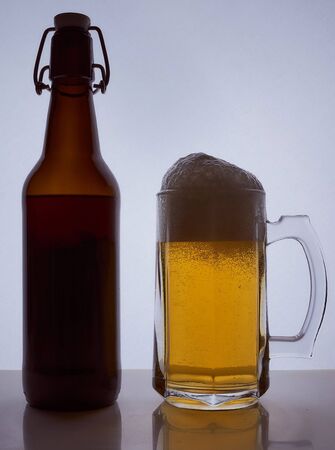 colored silhouette of a beer bottle with a cork on a black white background. Hight quality photoの写真素材