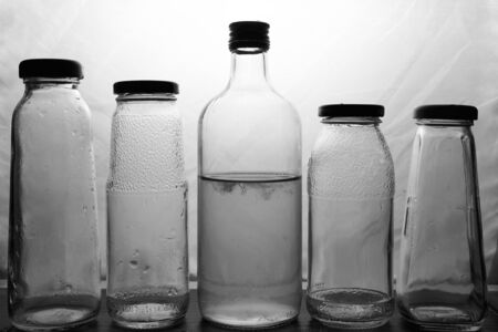 composition of glass bottles on a light background. High quality photoの写真素材