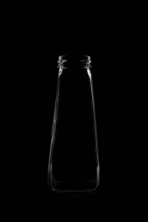 Silhouette of a bottle with a beautiful shape on a black background. High quality photoの写真素材