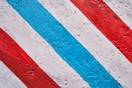 A red stop sign sitting on the side of a building Very high quality photoの写真素材
