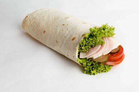 Hot roll with ham, lettuce, cucumber and tomatoes. High quality photoの写真素材