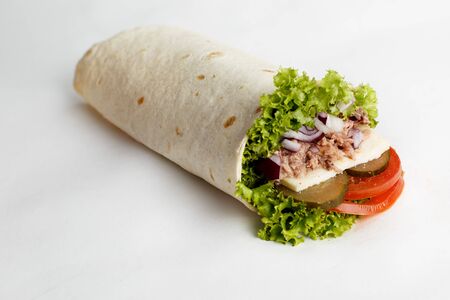 Hot roll with tuna, lettuce, onion, cucumber and tomatoes. High quality photoの写真素材