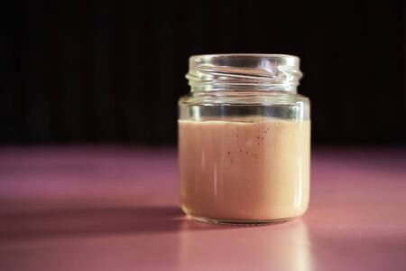 Homemade yeast swells in a swollen jar. High quality photoの写真素材