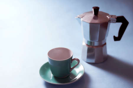 The geyser coffee maker stands on a blue background. With copy space.の写真素材
