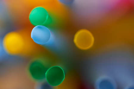 Blurred Background Multicolored Plastic Drinks Tubes. High quality photoの写真素材