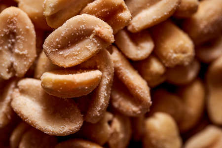 Salted peanuts on a wooden background. High quality photoの写真素材