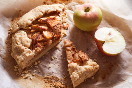 Homemade apple pie on mint paper background with ripe apples. High quality photoの写真素材