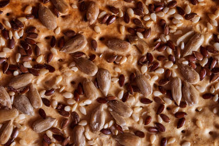 Flour breadcrumbs biscuits with sunflower flax seeds on awooden background. Top view. High quality...