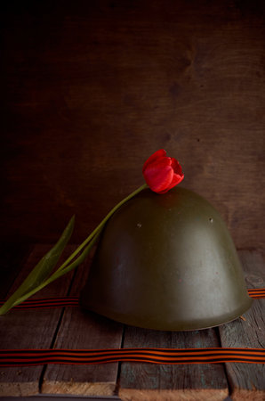 branches with white apple blossoms in an iron teapot on a brown background. high quality photoの写真素材