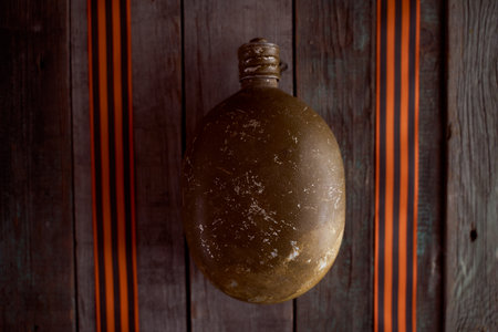 Black orange St. George ribbons on a wooden background. high quality photoの写真素材