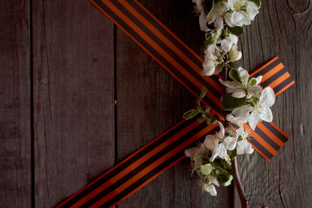 Black orange St. George ribbons on a wooden background. high quality photo
