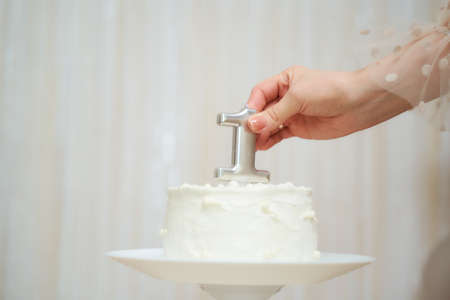 Cake for a one-year-old child with the number one yearの写真素材