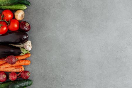 Local market fresh vegetable, garden produce on gray cement, clean eating and dieting concept. Flat lay with empty space. Food background. Top viewの写真素材