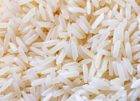 A close up view of uncooked white rice.の写真素材