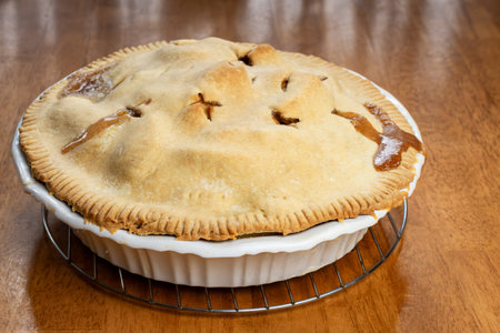 Making a pie:  Completed pie on the wooden table.の写真素材