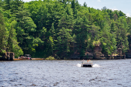 Boaters take a shore lunch on a sandbar along the Wisconsin River in the Wisconsin Dells.