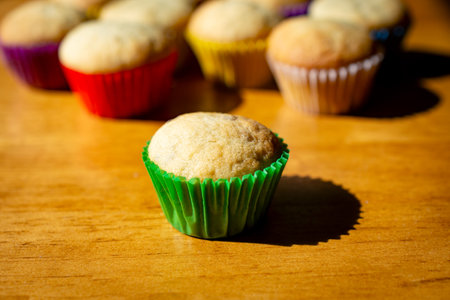 A mini banana muffin upclose with additional muffins in the backgroundの写真素材