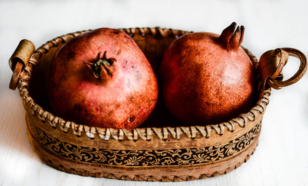 Basket with pomegranates