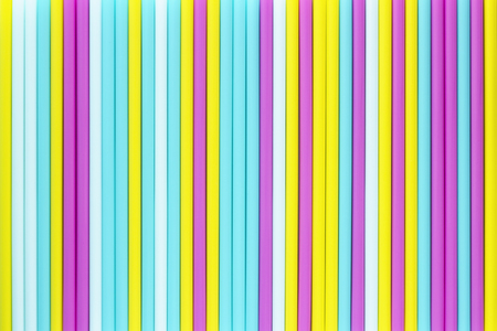 Abstract background of colorful cocktail tubes. Close-up top view image. Colored plastic drinking straws texture.の写真素材