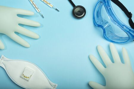 Coronavirus protective kit concept with copy space. Medical latex gloves, protective glasses,...