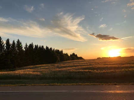 Fall sunset over farm's field
