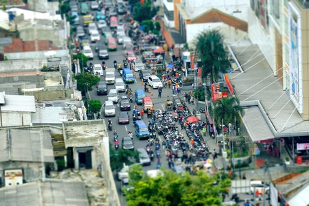 Crowded road traffic seen from top, with many motorcycles parking in side of road, make traffic jamのeditorial素材