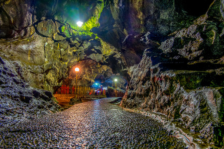 Beautiful cave floor and colorful cave wall in cave passage, illuminated by lamp,  Captured from Lawa cave, Purbalingga, Indonesia.の写真素材