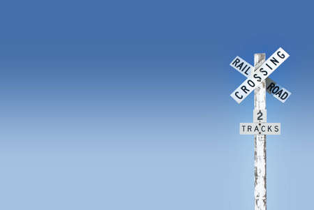 railroad crossing signal on blue gradient backgroundの写真素材