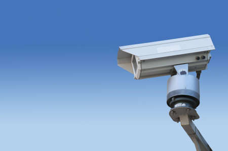 Surveillance camera isolated on blue degradation