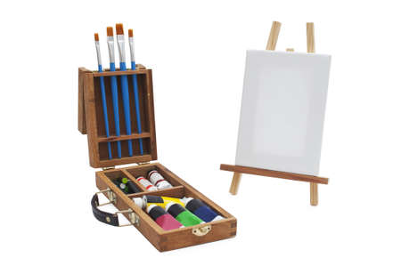 Canvas with brushes and acrylic briefcase isolated on white backgroundの写真素材