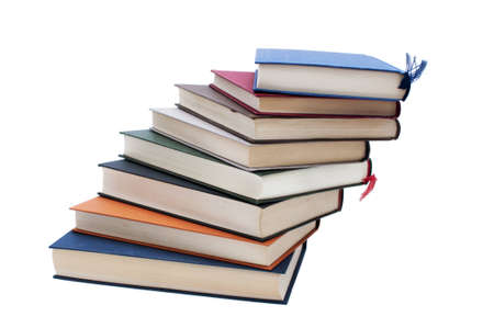 Books stacked in a spiral pattern, isolated on white backgroundの写真素材