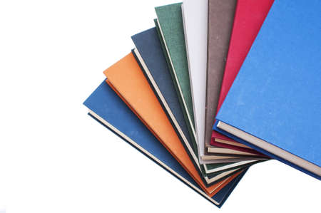 Books stacked in a spiral isolated on white backgroundの写真素材