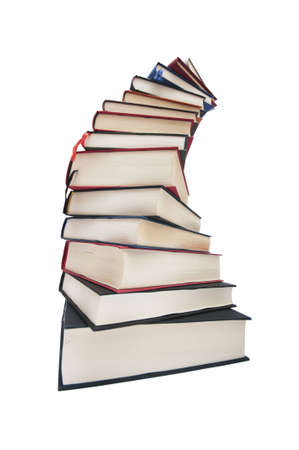 Books stacked in a spiral isolated on white backgroundの写真素材