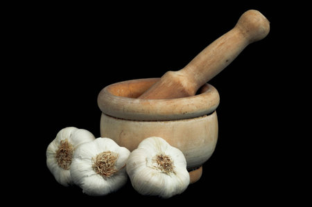 wooden mortar with garlicの写真素材