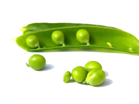 detail of green peas isolation over white backgroundの写真素材
