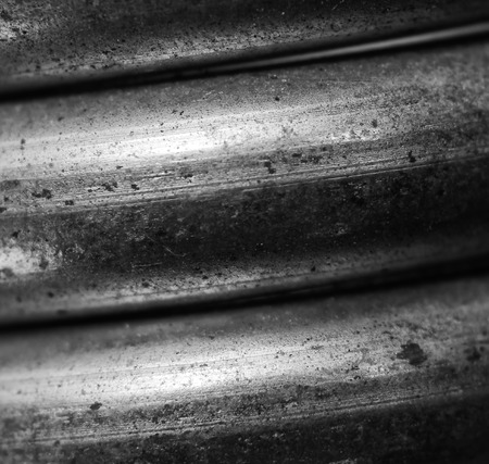 Macro closeup detail of coiled metal spring in black and white colorの写真素材