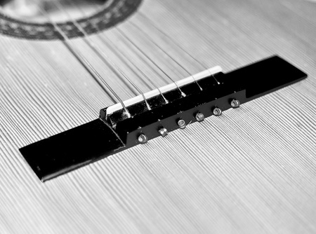 Closeup detail of a guitar. Music theme and background in black and white colors..の写真素材