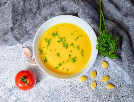 Vegetarian autumn pumpkin cream soup with seedsの写真素材