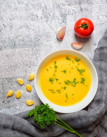 Vegetarian autumn pumpkin cream soup with seedsの写真素材