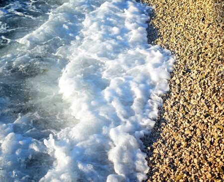 Soft wave of blue ocean on sandy beach. Background.の写真素材
