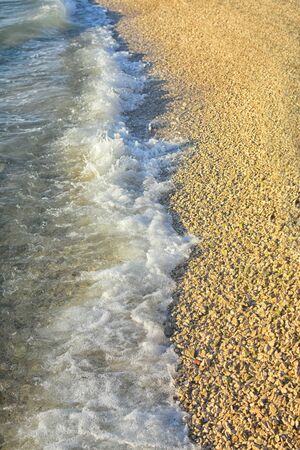 Soft wave of blue ocean on sandy beach. Background.の写真素材