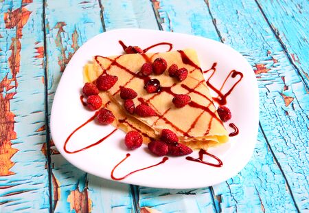 pancakes with fresh blackberries and raspeberries, top view, horizontalの写真素材