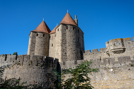 Castle walls of the fortress La CitÃ© with towers, Carcassonne, Franceのeditorial素材