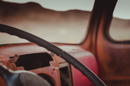 Old, red car from inside in Rhyolite, Death Valley, California, USAの写真素材
