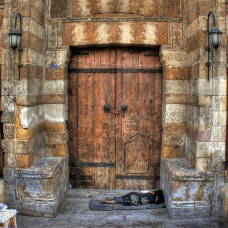Indigent homeless at the door of a church in Cairo (Egypt)の写真素材