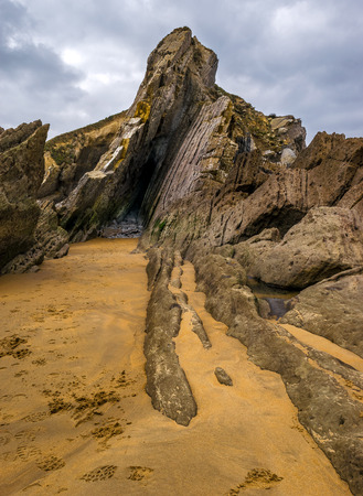 In a flysch layers of hard rocks (limestones, slates and sandstones) are alternated with layers of soft materials (clays and loams)の写真素材