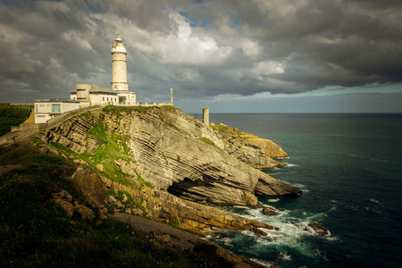 Bella Vista lighthouse and cliffs in the greater Cape of Santander (Cantabria, Spain)の写真素材